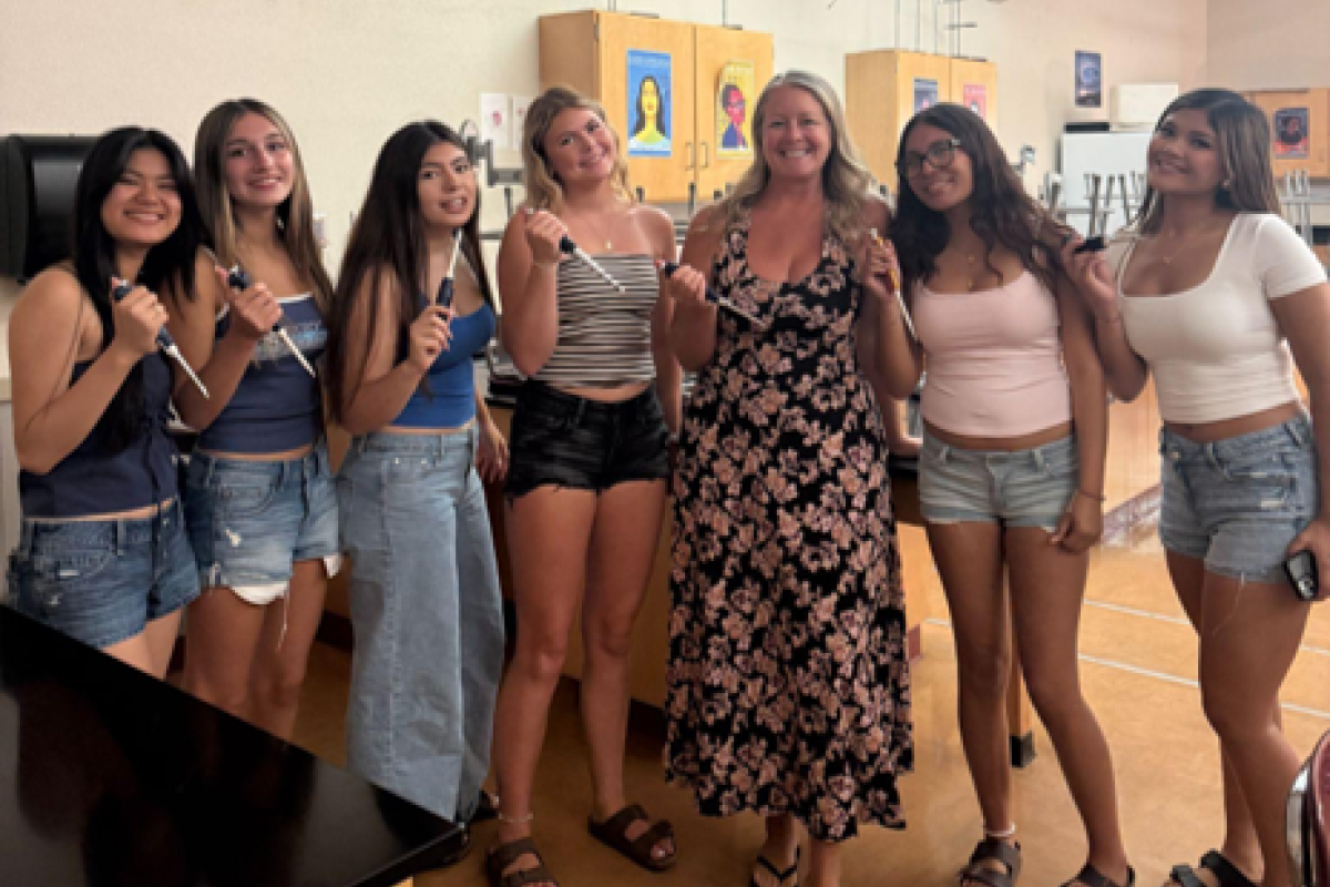 ABE teacher Corey Spainhower surrounded by her students at Liberty High School
