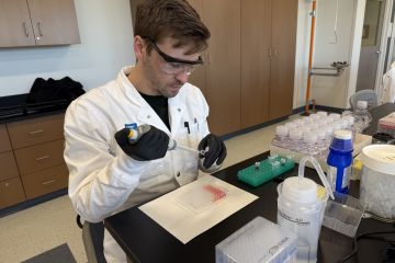 Drew Spacht working with a micropipette