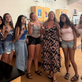 ABE teacher Corey Spainhower surrounded by her students at Liberty High School