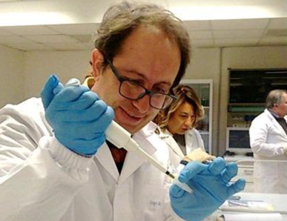 Male teacher working with micropipette