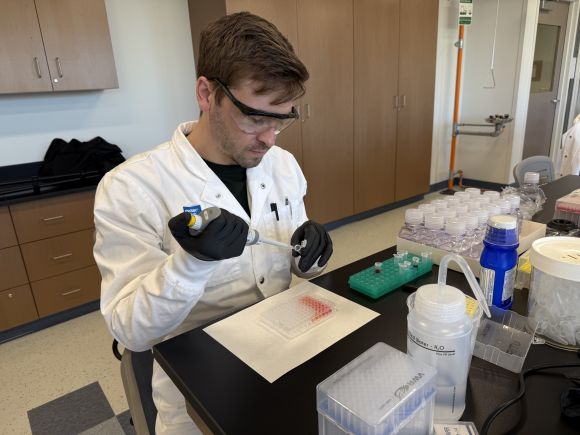 Drew Spacht working with a micropipette