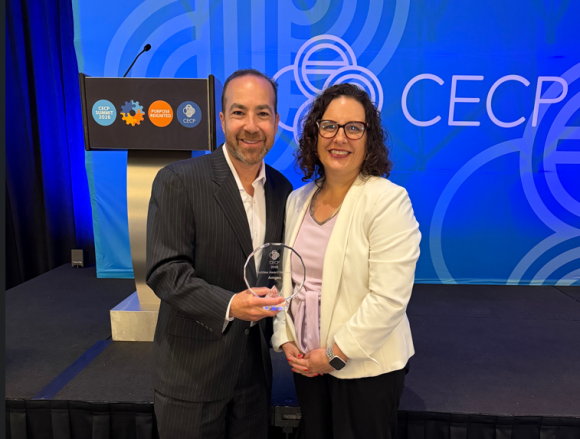 Scott Heimlich and Rebecca Lewis holding the CECP award for ABE