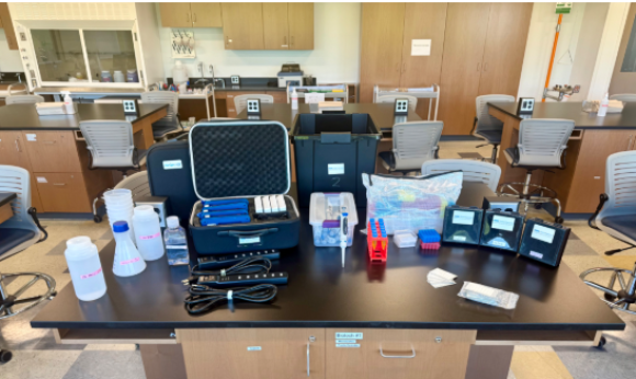 table covered in lab equipment