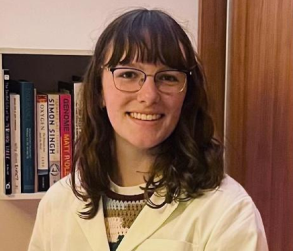emer cummins college student brown hair bangs glasses smiling