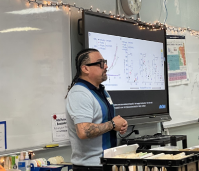 Raul Lazaro presenting about his career to a science classroom